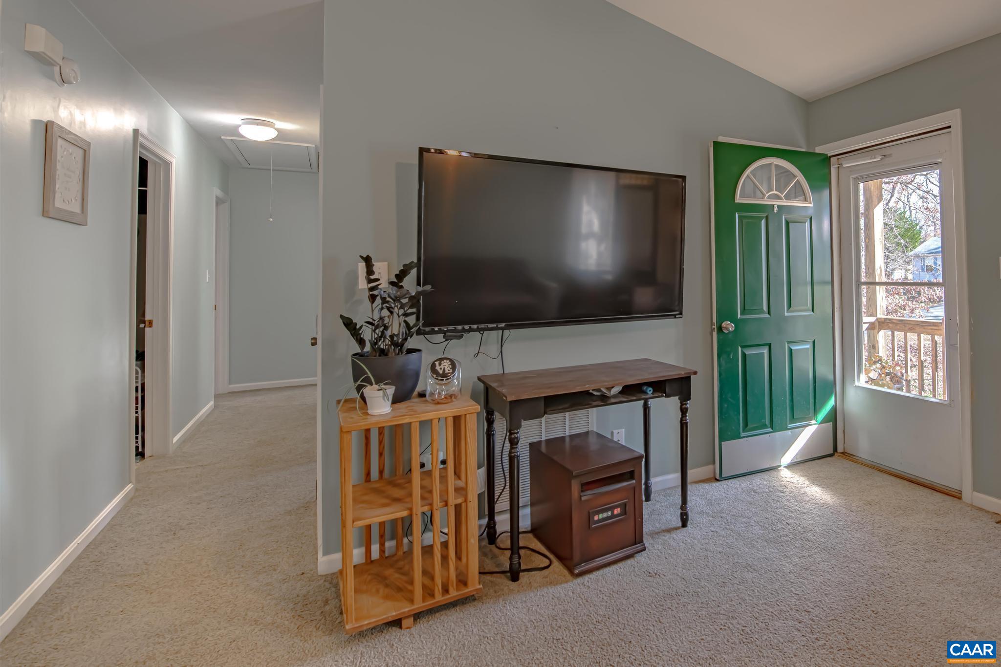 18 Cliftwood Road Palmyra, VA 22963 - Photo 9 of 28 a living room with furniture and a flat screen tv