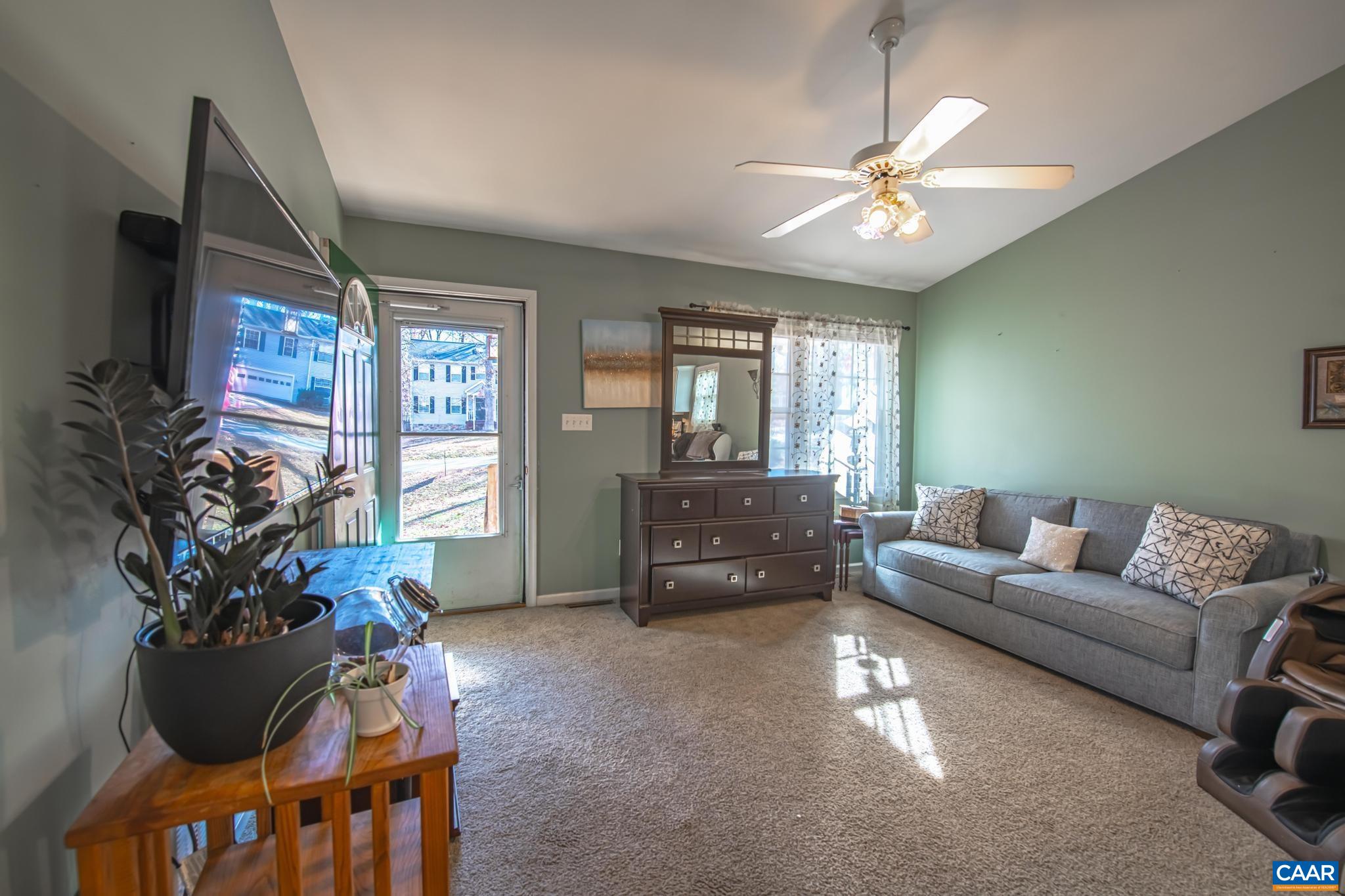 18 Cliftwood Road Palmyra, VA 22963 - Photo 10 of 28 a living room with furniture and a flat screen tv