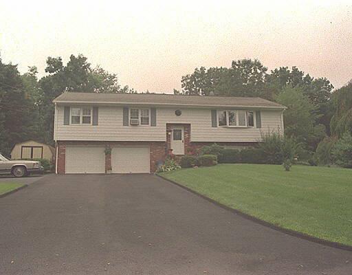 6 Coach Road Danbury, CT 06811 - Photo 1 of 1 a house view with a garden space