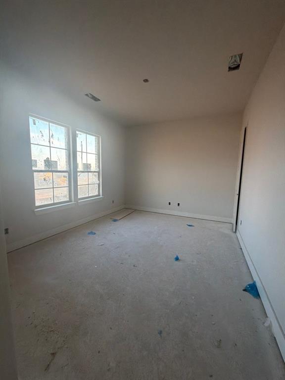 1002 Webb Court Van Alstyne, TX 75495 - Photo 4 of 11 an empty room with windows