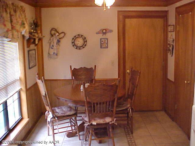 8002 Claret Street Amarillo, TX 79110 - Photo 4 of 13 a view of a dining room with furniture and window