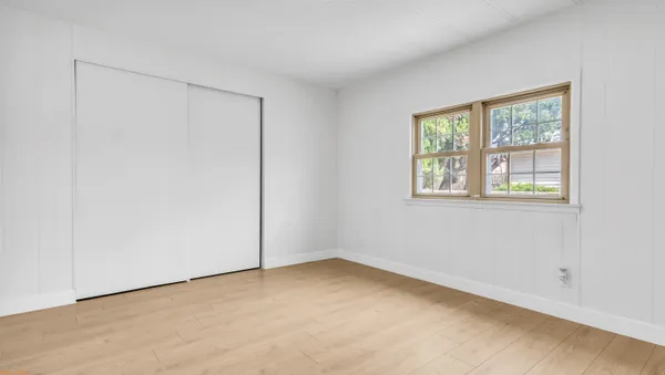 a view of an empty room with a window