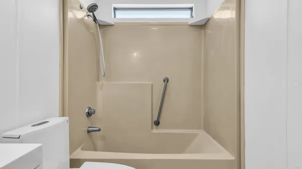a view of a bathroom with a bathtub