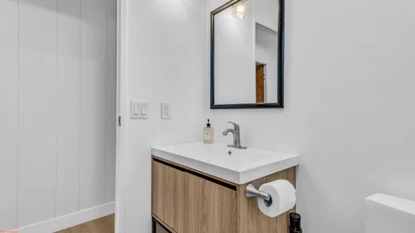 a bathroom with a sink and a mirror