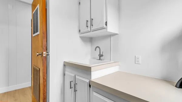 a view of a hallway with washer and dryer