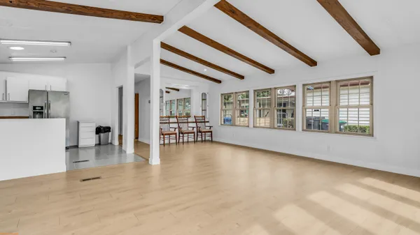 a view of an entryway with wooden floor