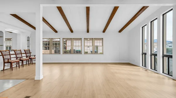 a view of an entryway with wooden floor
