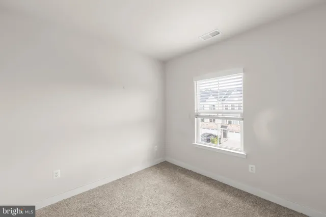 a view of a house with wooden deck and a floor