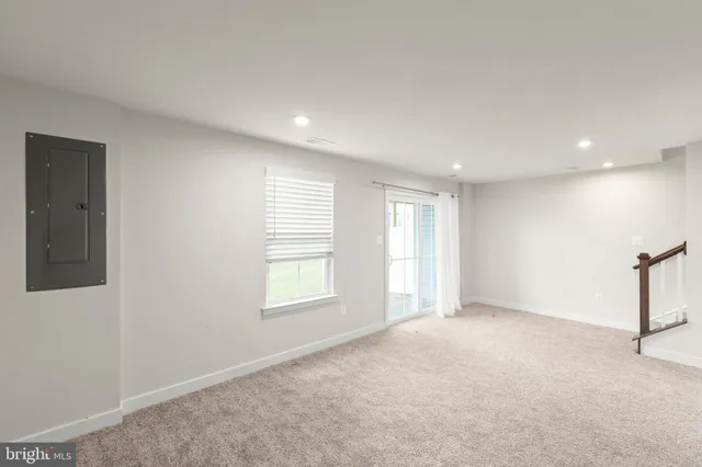 a view of an empty room with stairs