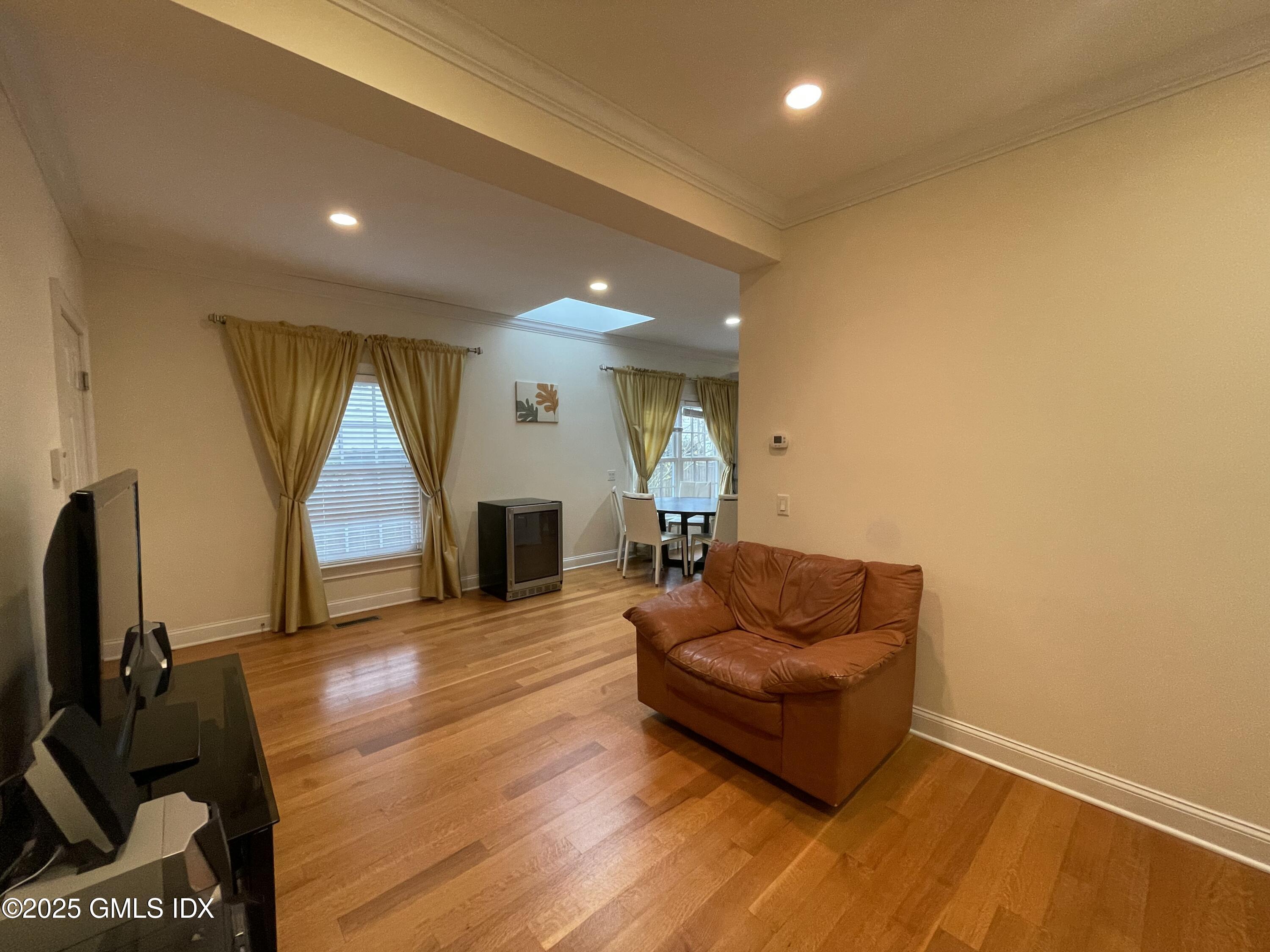 1 Northfield Street, Unit B Greenwich, CT 06830 - Photo 11 of 30 a living room with furniture and a flat screen tv