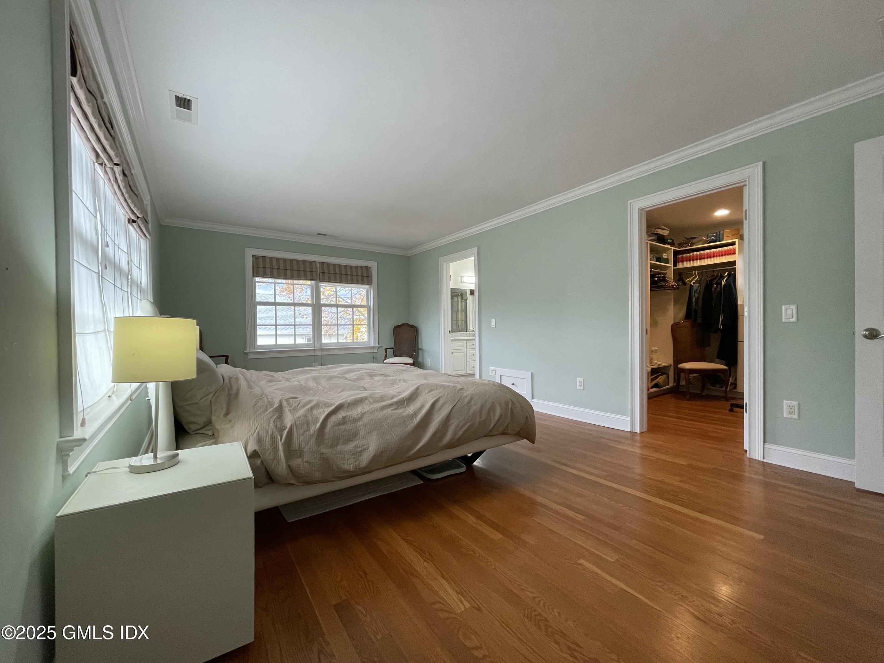 1 Northfield Street, Unit B Greenwich, CT 06830 - Photo 12 of 30 a bedroom with a bed and a lamp on dresser