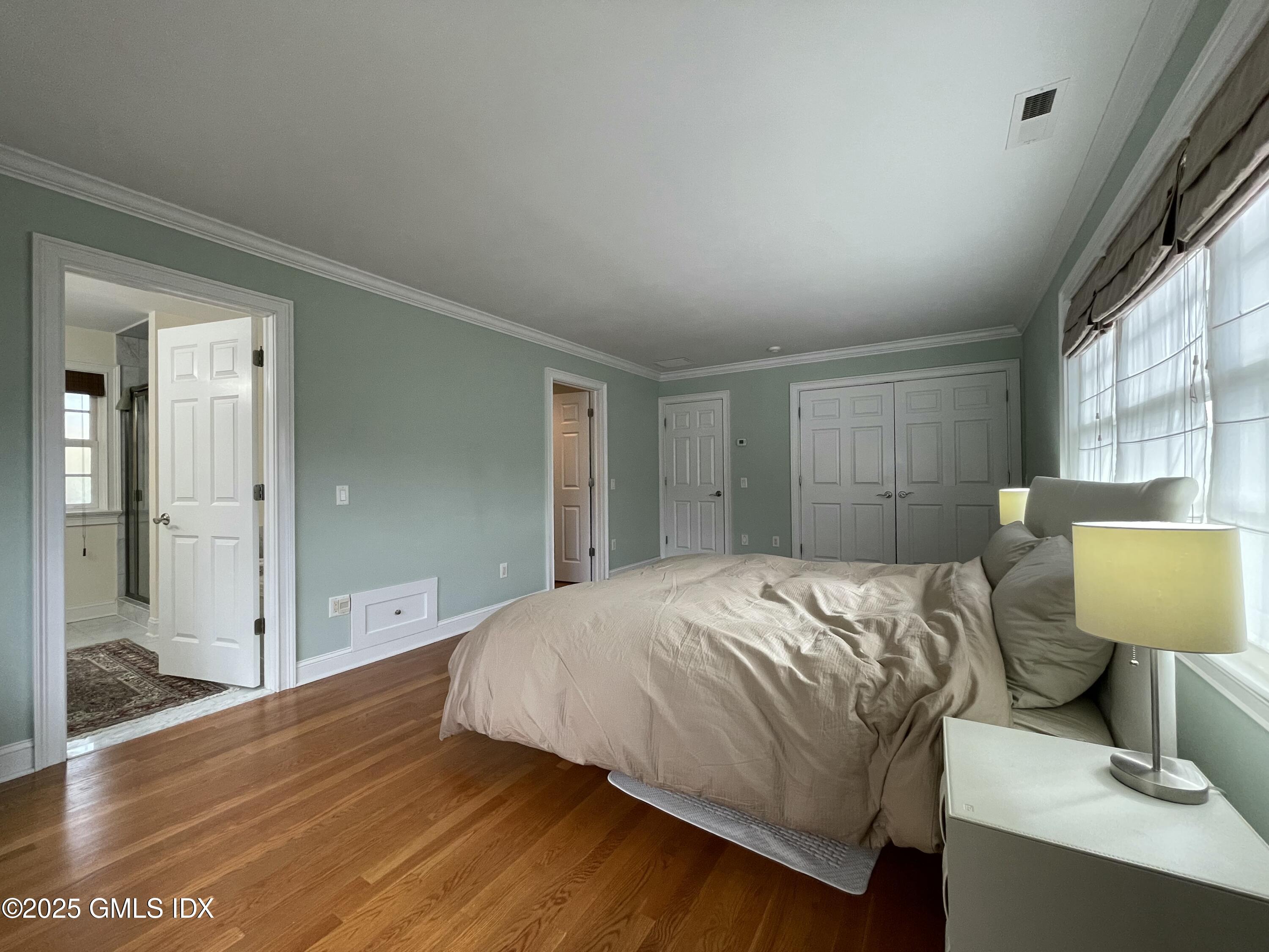 1 Northfield Street, Unit B Greenwich, CT 06830 - Photo 13 of 30 a bedroom with a bed and a couch