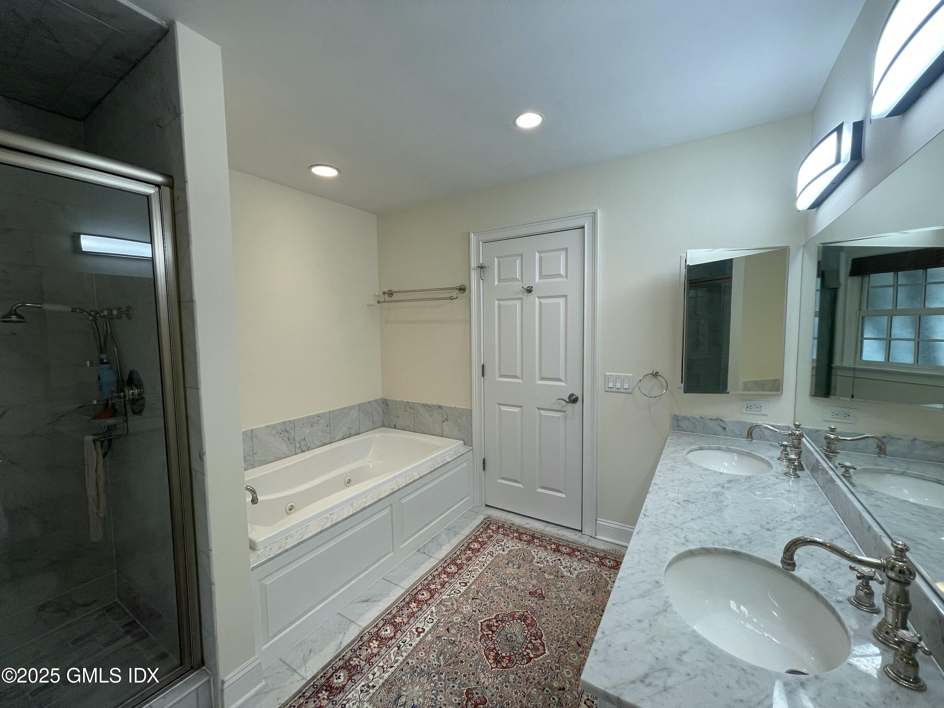 1 Northfield Street, Unit B Greenwich, CT 06830 - Photo 16 of 30 a bathroom with a granite countertop sink and a mirror