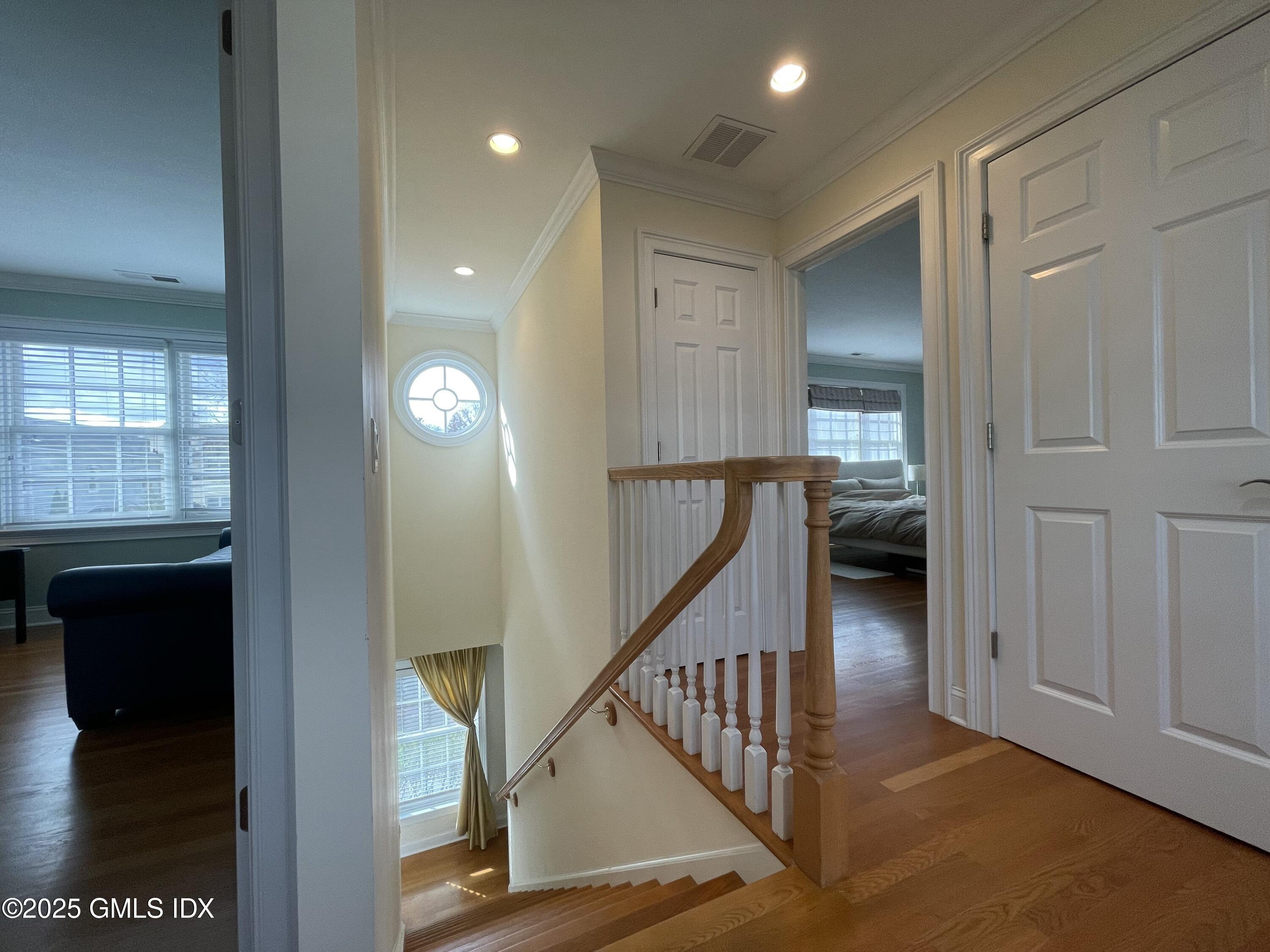 1 Northfield Street, Unit B Greenwich, CT 06830 - Photo 17 of 30 a view of a hallway with wooden floor and staircase