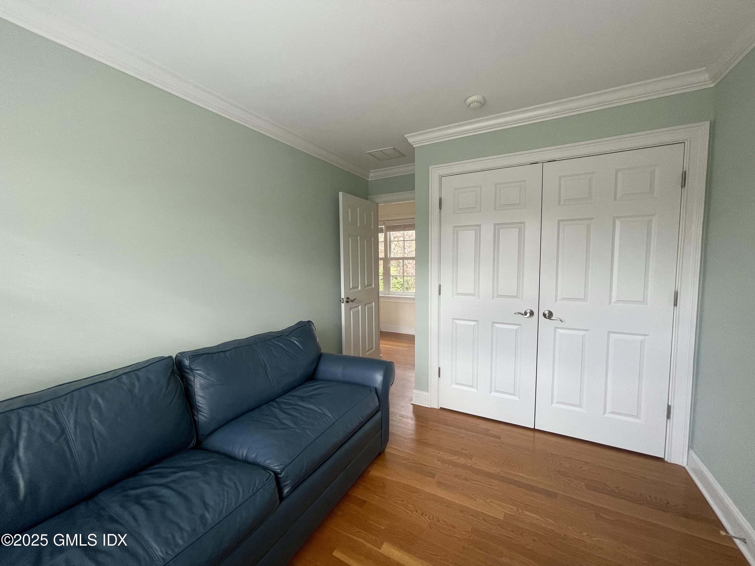 1 Northfield Street, Unit B Greenwich, CT 06830 - Photo 23 of 30 a living room with a couch and a window
