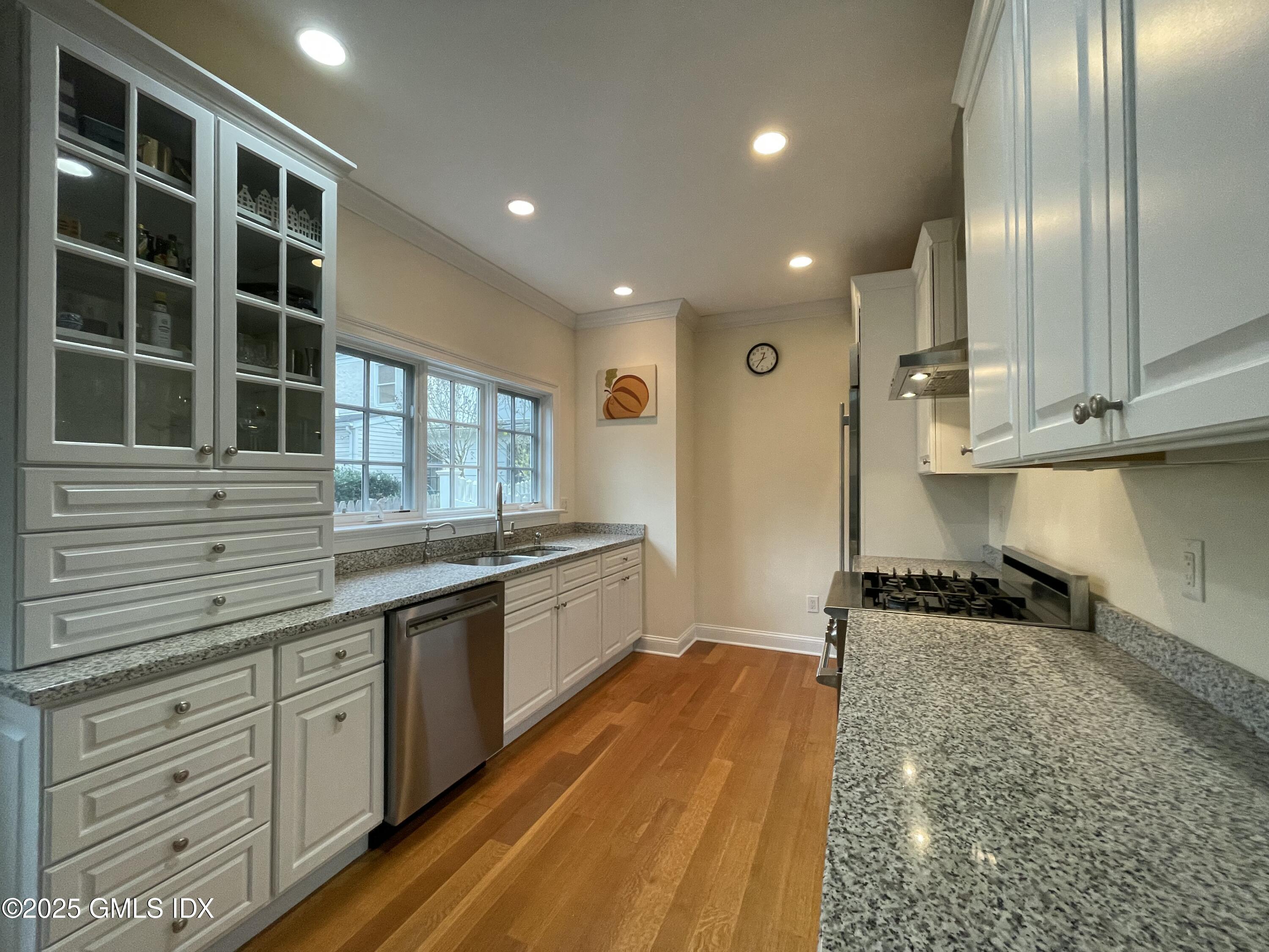 1 Northfield Street, Unit B Greenwich, CT 06830 - Photo 7 of 30 a large kitchen with granite countertop a large counter top appliances and cabinets