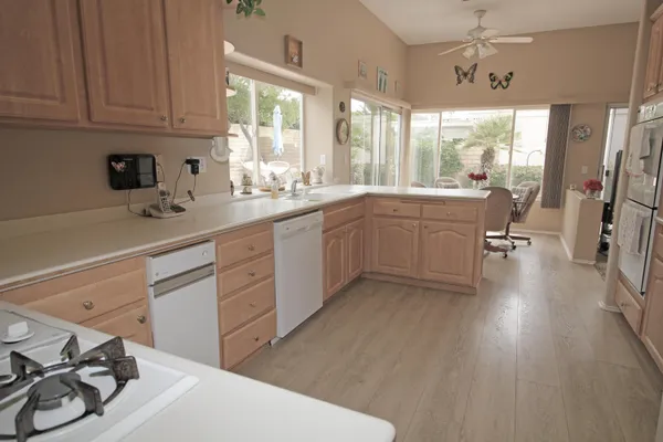 a kitchen with sink cabinets and appliances