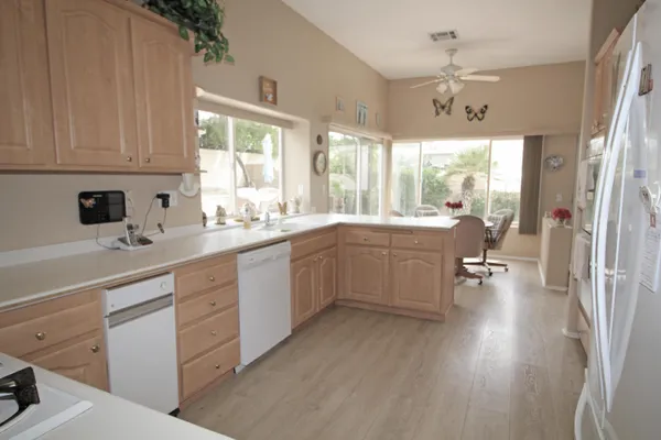a kitchen with a sink cabinets and window