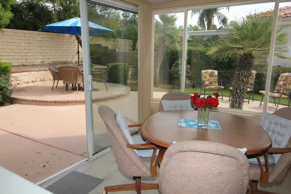 a dining table with chairs and table in front of it