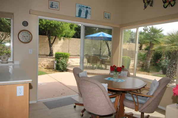 a dining room with furniture window and outside view