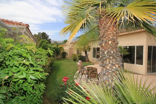 a view of a backyard of the house
