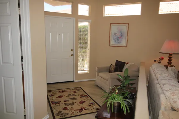a living room with furniture and a rug
