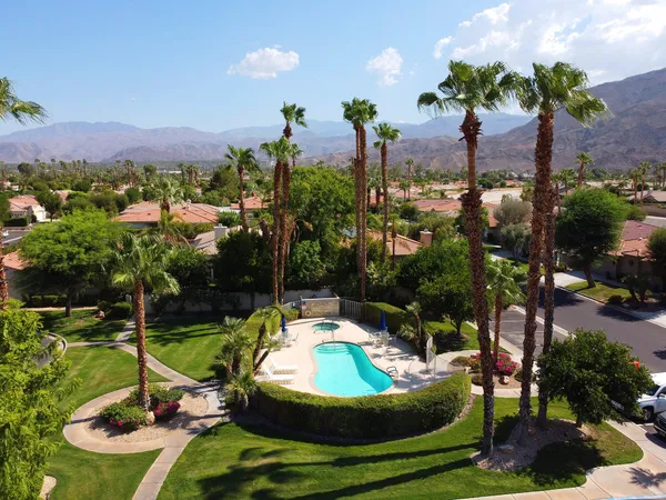 a view of a swimming pool with a yard
