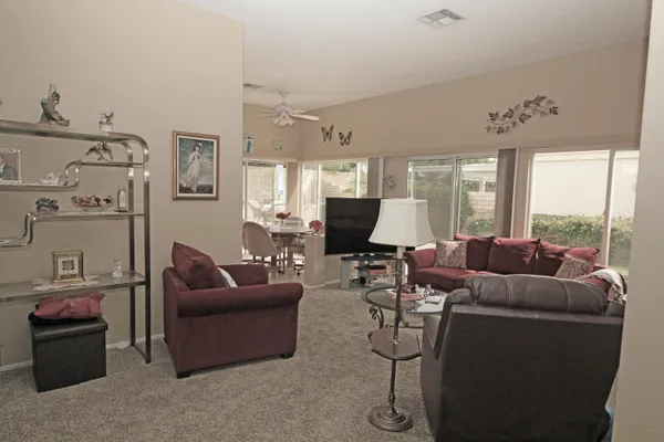 a living room with furniture and a large window