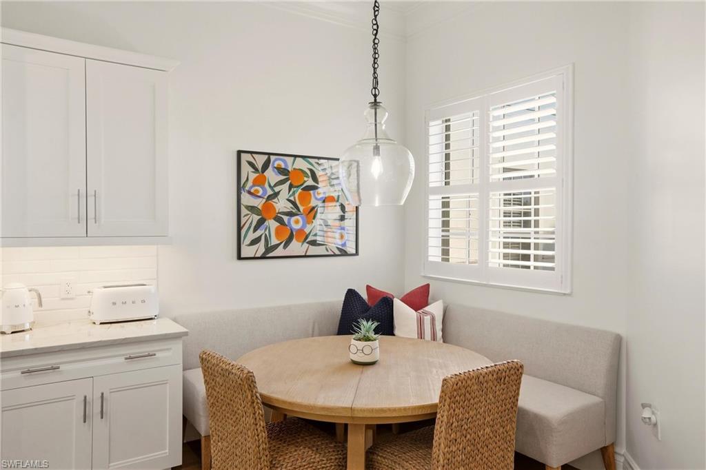 9263 Museo Circle, Unit 202 Naples, FL 34114 - Photo 17 of 50 a dining room with furniture and window