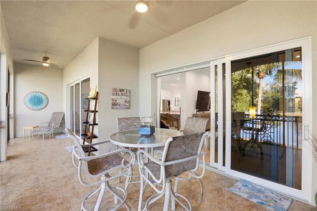 9263 Museo Circle, Unit 202 Naples, FL 34114 - Photo 23 of 50 a view of a dining room with furniture window and outside view