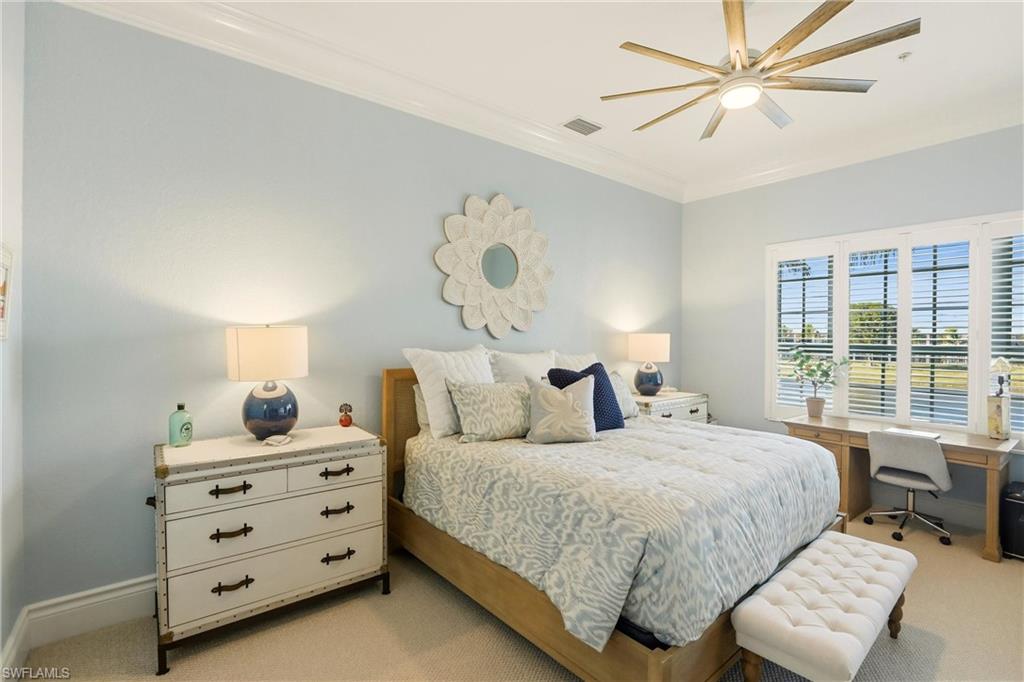 9263 Museo Circle, Unit 202 Naples, FL 34114 - Photo 25 of 50 a bedroom with a bed dresser and a window
