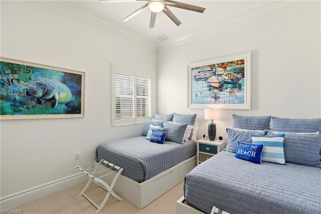 9263 Museo Circle, Unit 202 Naples, FL 34114 - Photo 30 of 50 a bedroom with a bed and a painting on the wall