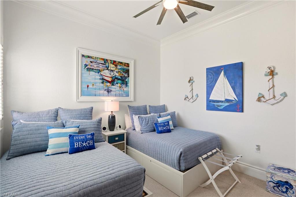 9263 Museo Circle, Unit 202 Naples, FL 34114 - Photo 31 of 50 a bedroom with a bed and a painting on the wall