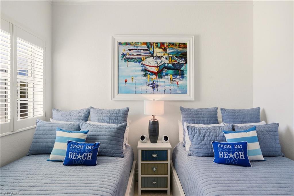 9263 Museo Circle, Unit 202 Naples, FL 34114 - Photo 32 of 50 a living room with furniture and a couch