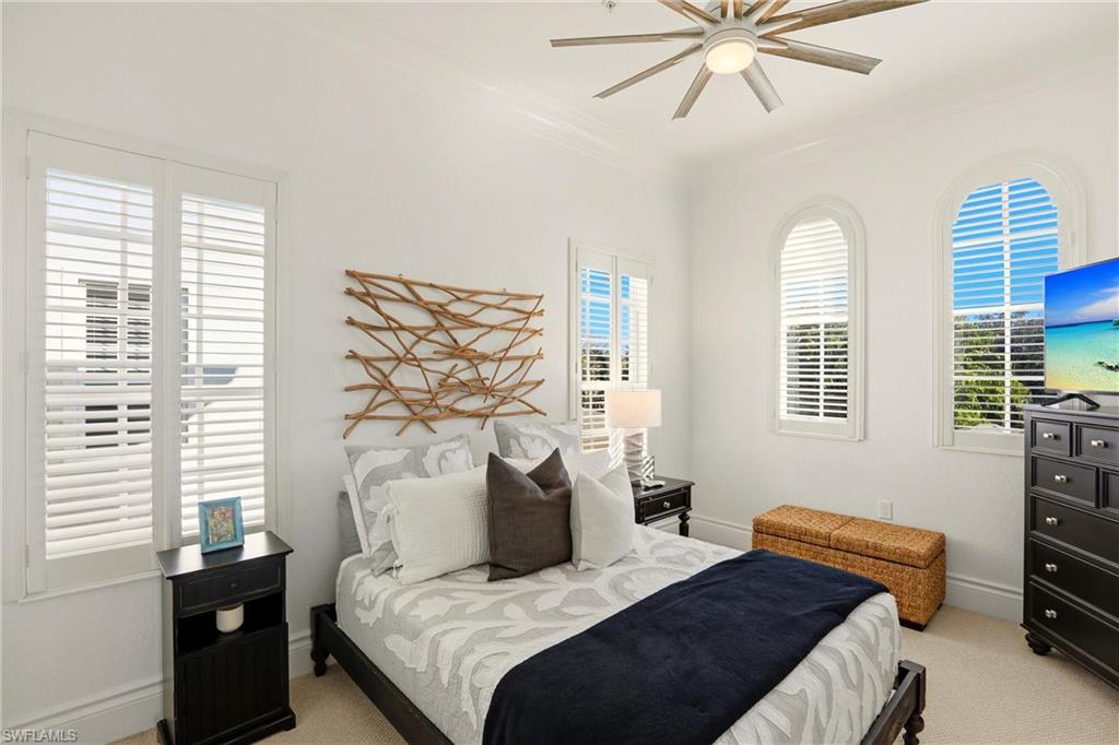 9263 Museo Circle, Unit 202 Naples, FL 34114 - Photo 36 of 50 a bedroom with a bed and a window