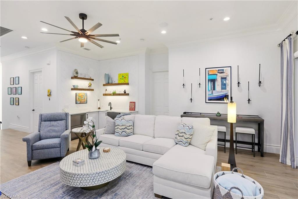 9263 Museo Circle, Unit 202 Naples, FL 34114 - Photo 6 of 50 a living room with furniture and a large window