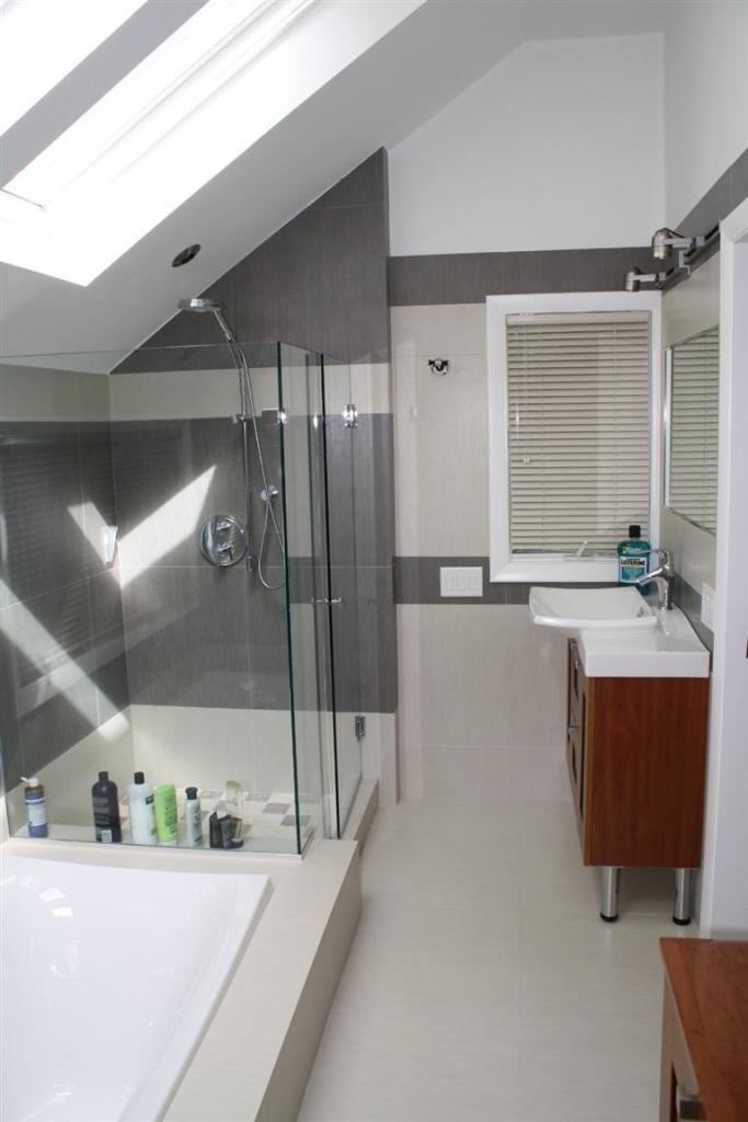 103 Paddock Circle Mashpee, MA 02649 - Photo 17 of 27 a bathroom with a tub sink and mirror