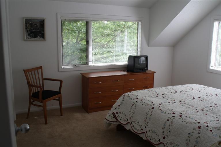 103 Paddock Circle Mashpee, MA 02649 - Photo 23 of 27 a bedroom with a bed and a window