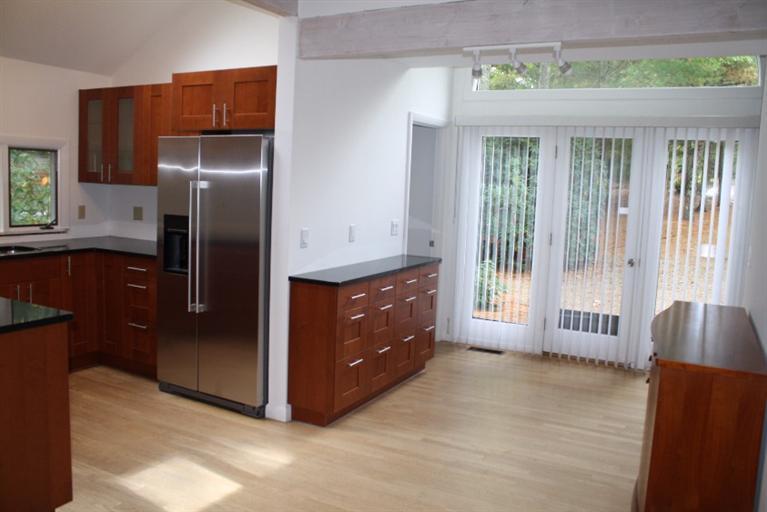 103 Paddock Circle Mashpee, MA 02649 - Photo 7 of 27 a kitchen with stainless steel appliances granite countertop a refrigerator and a sink