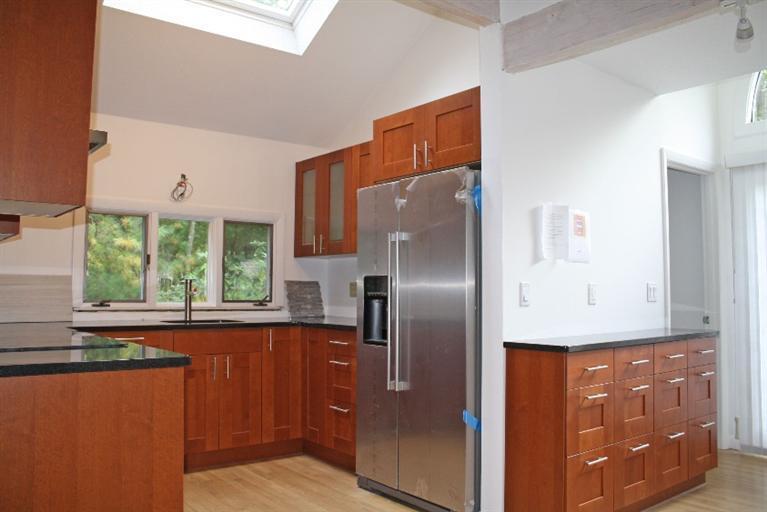 103 Paddock Circle Mashpee, MA 02649 - Photo 8 of 27 a kitchen with stainless steel appliances granite countertop a refrigerator and a sink