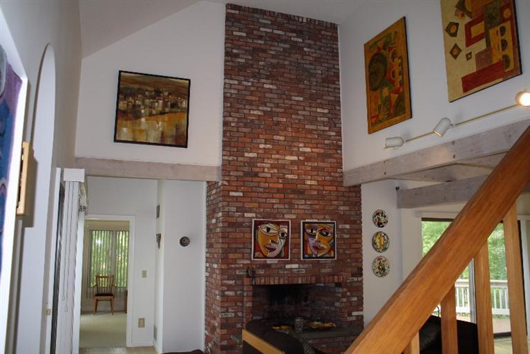 103 Paddock Circle Mashpee, MA 02649 - Photo 10 of 27 a front view of a house with large windows