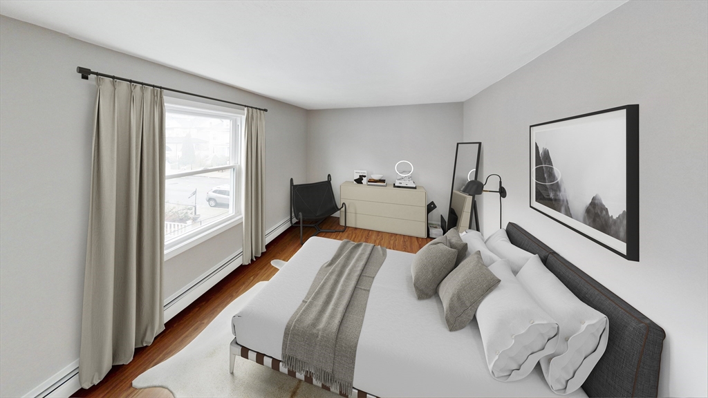49 Rosedale Street, Unit 2 Boston, MA 02124 - Photo 6 of 9 a living room with furniture and a large window