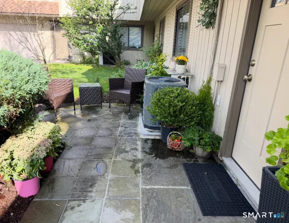 a garden with flowers in front of it