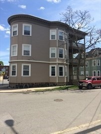180 Lewis Street, Unit 2 Lynn, MA 01902 - Photo 14 of 14 a front view of a house with a yard