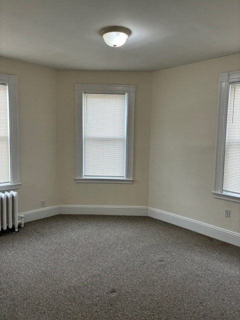 180 Lewis Street, Unit 2 Lynn, MA 01902 - Photo 10 of 14 an empty room with a window