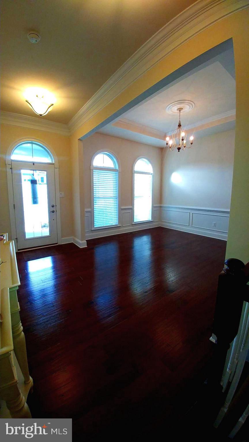 18714 Crimson Road Rehoboth Beach, DE 19971 - Photo 9 of 57 Foyer and Formal Dining Room Area
