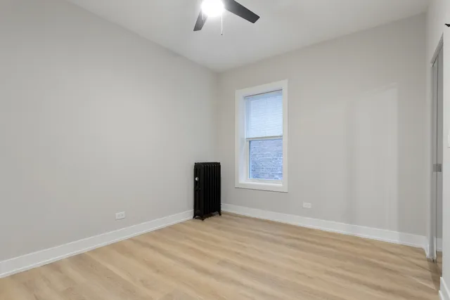 an empty room with a empty space and a window