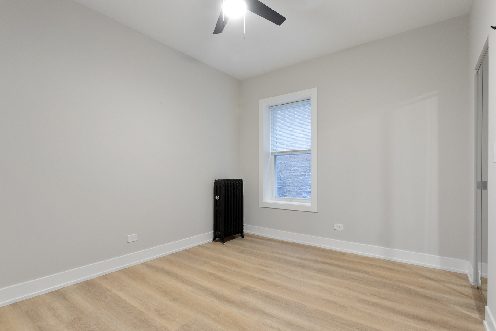 1904 West Morse Avenue, Unit 1 Chicago, IL 60626 - Photo 10 of 15 an empty room with a empty space and a window