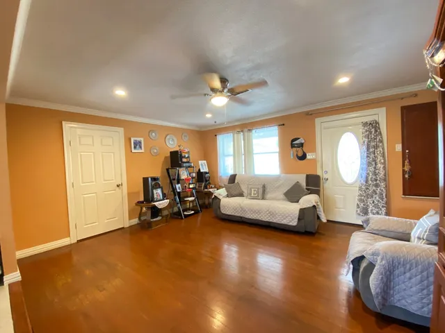 a living room with furniture and a large window