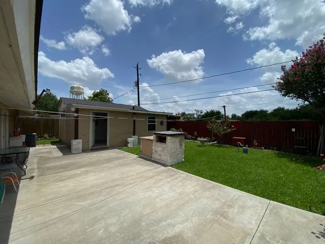 a living room with furniture windows and a flat screen tv